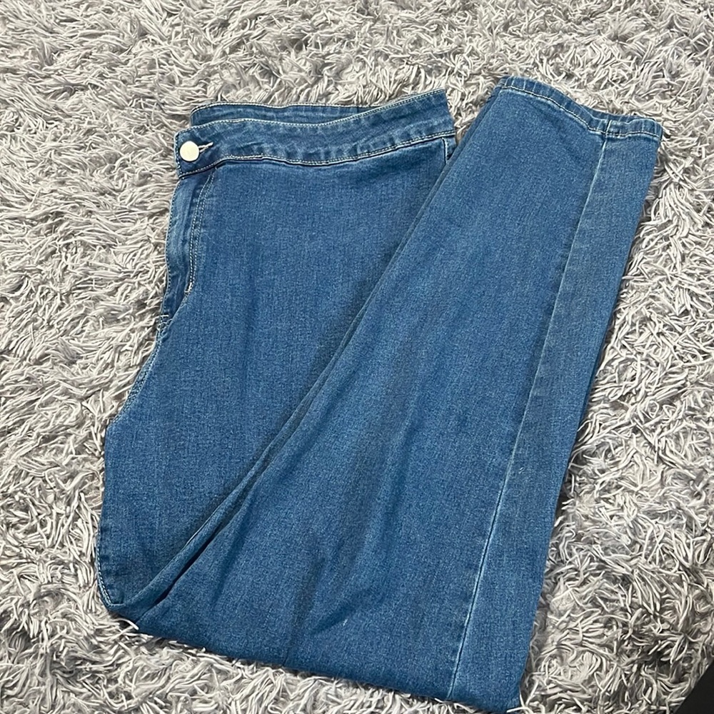 Plain blue jeans.